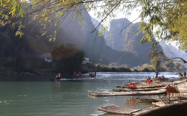 Bamboo rafts on the Yulong River below karst hills in Yangshuo
